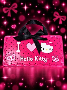 Hello Kitty pink ceramic hanging wall sign with black ribbon.